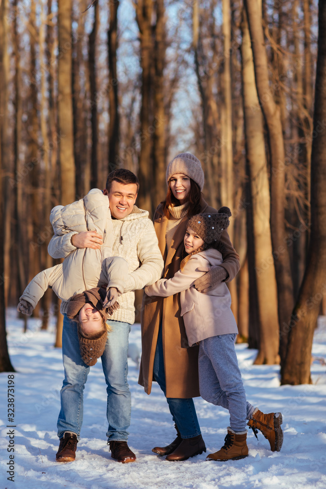 parents in the snowy forest to play with the kids