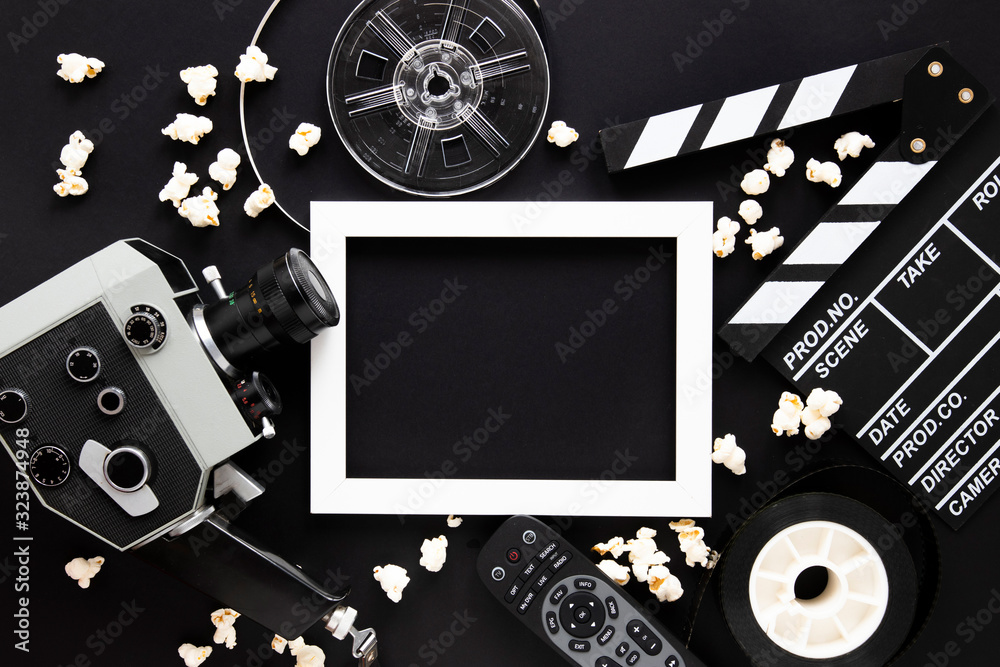 Movie elements on black background with empty frame