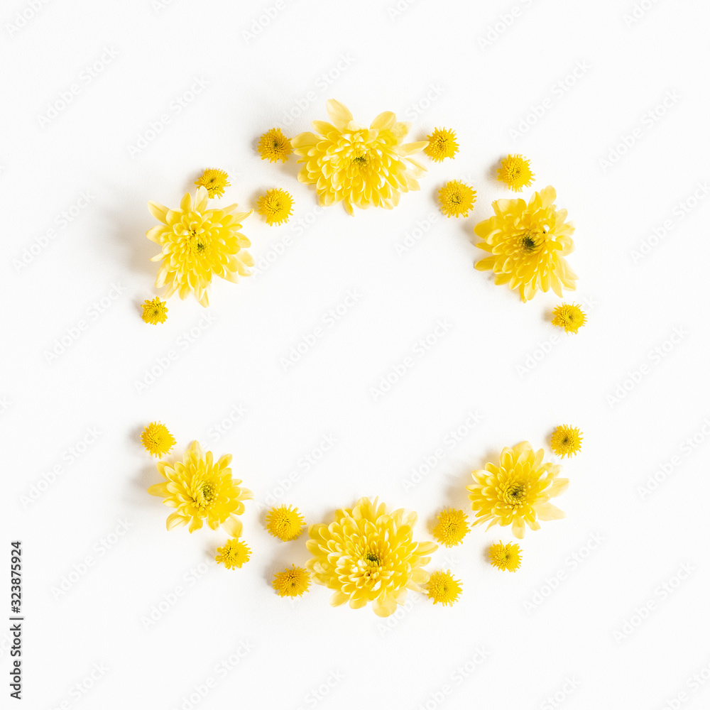 Flowers composition. Wreath made of yellow chrysanthemum flowers on white background. Flat lay, top view Flowers composition. Wreath made of yellow chrysanthemum flowers on white background. Flat lay, top view