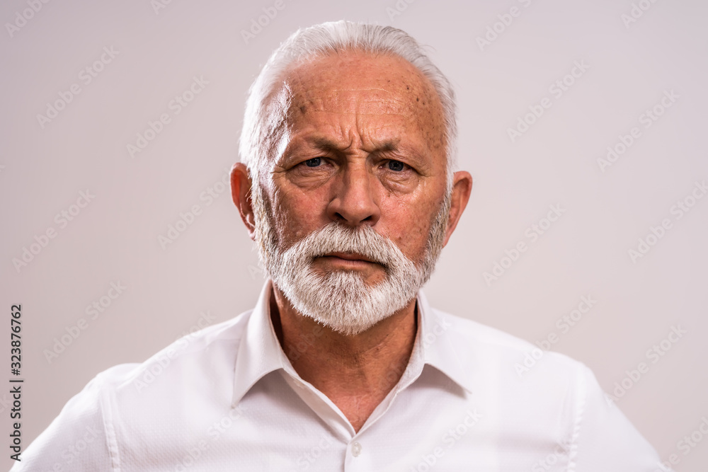 Portrait of serious and authoritative senior man. Portrait of serious and authoritative senior man.