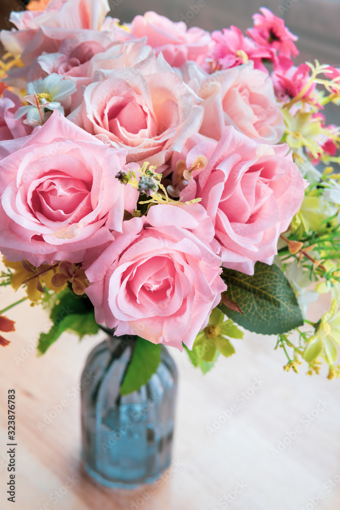 A bouquet of pink roses in a vase