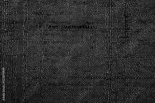 Black linen fabric texture or background.