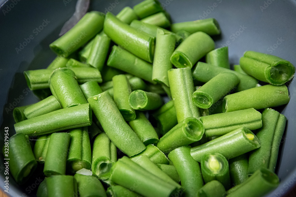 Bowl of freshly cut into pieces green snap or string beans Bowl of freshly cut into pieces green snap or string beans