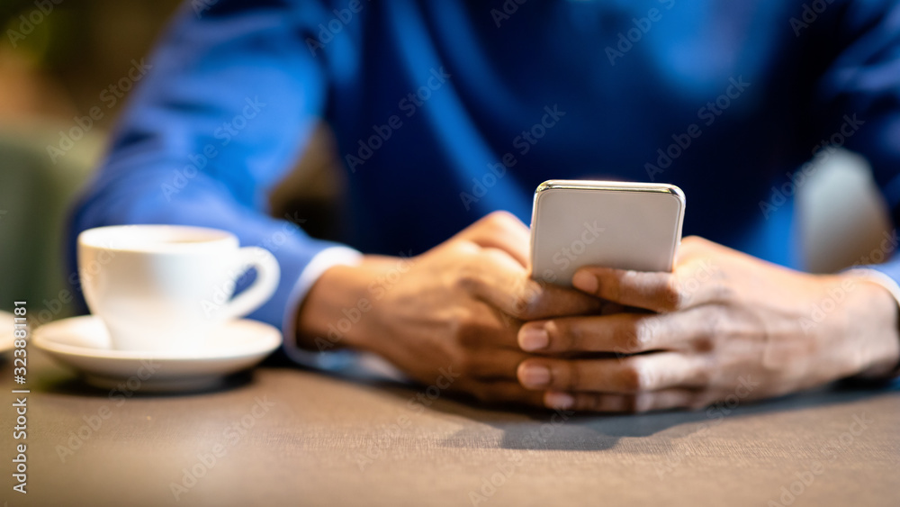 Close up of young man using his smart phone Close up of young man using his smart phone