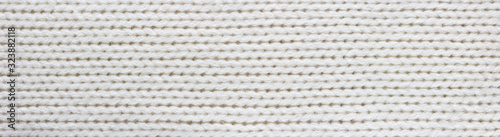 Knitted white fabric texture, stockinette stitch, macro