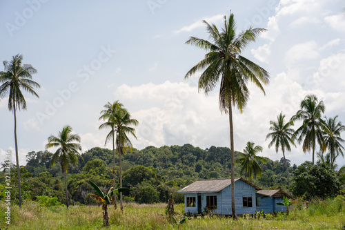 traditional melayu house on the beach photo