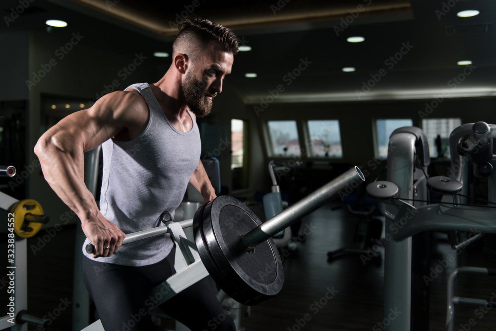 Muscular Man Doing Heavy Weight Exercise for Back