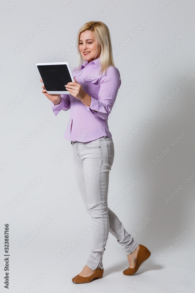 Smiling business woman with tablet computer. Isolated over white background Smiling business woman with tablet computer. Isolated over white background