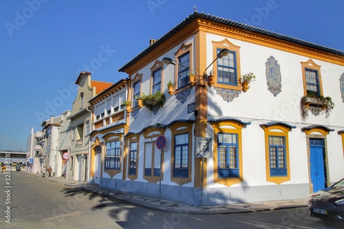 Old colorful typical facades next to the water canal in Aveiro village in Porto