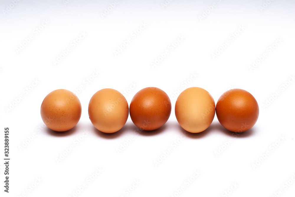 5 eggs lined up in a white background 5 eggs lined up in a white background