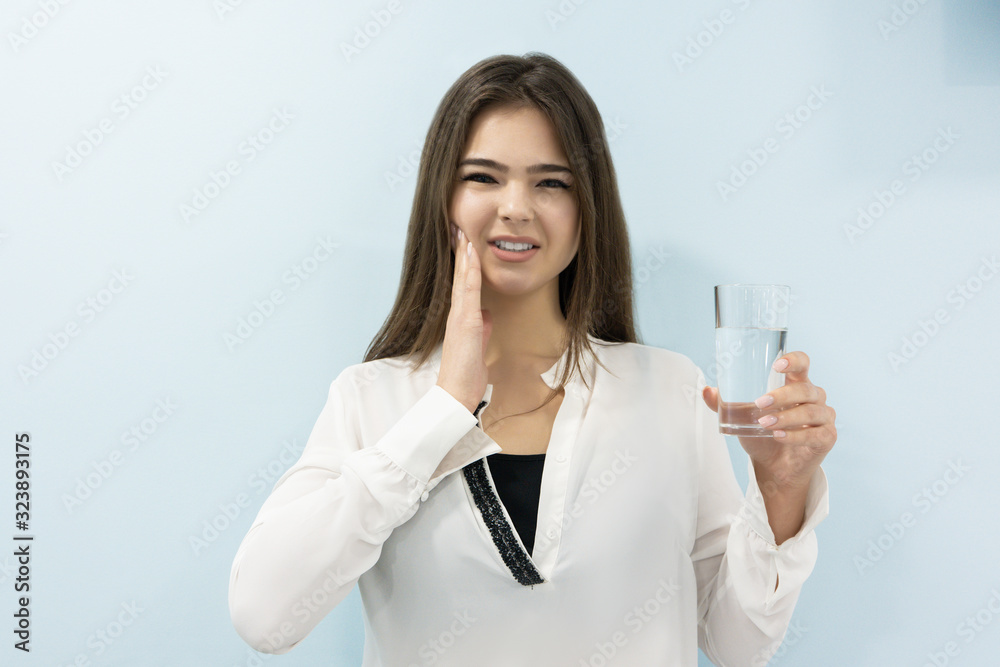 young beautiful blond woman standing on isolated white background suffering from sudden toothache taking pill, healthcare and medical young beautiful blond woman standing on isolated white background suffering from sudden toothache taking pill, healthcare and medical