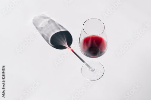 a glass of red wine on a white background