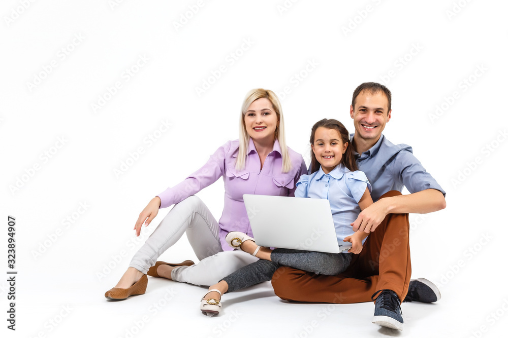 family with laptop over white background