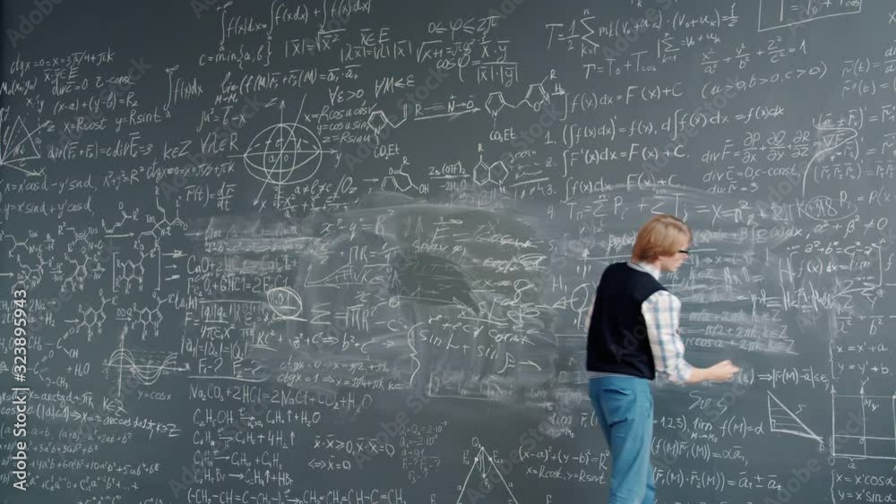 Time lapse of intelligent guy in glasses writing scientific formulas on chalkboard at school busy with education. Modern people, lifestyle and youth concept. Time lapse of intelligent guy in glasses writing scientific formulas on chalkboard at school busy with education. Modern people, lifestyle and youth concept.