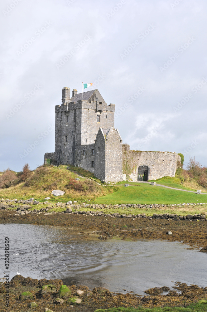 Dunguaire castle in Ireland with cloudy sky Dunguaire castle in Ireland with cloudy sky