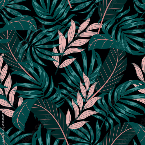Abstract seamless tropical pattern with green and pink leaves and plants on a dark background. Trendy summer Hawaii print. Floral pattern. Printing with in hand drawn style. Jungle leaves.