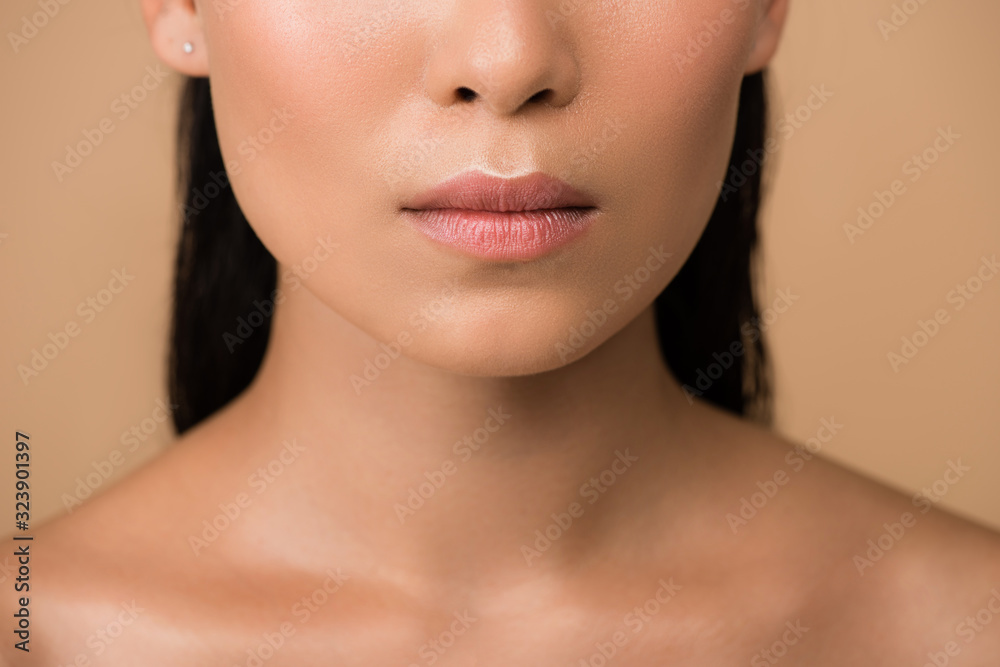 cropped view of beautiful naked asian girl isolated on beige cropped view of beautiful naked asian girl isolated on beige