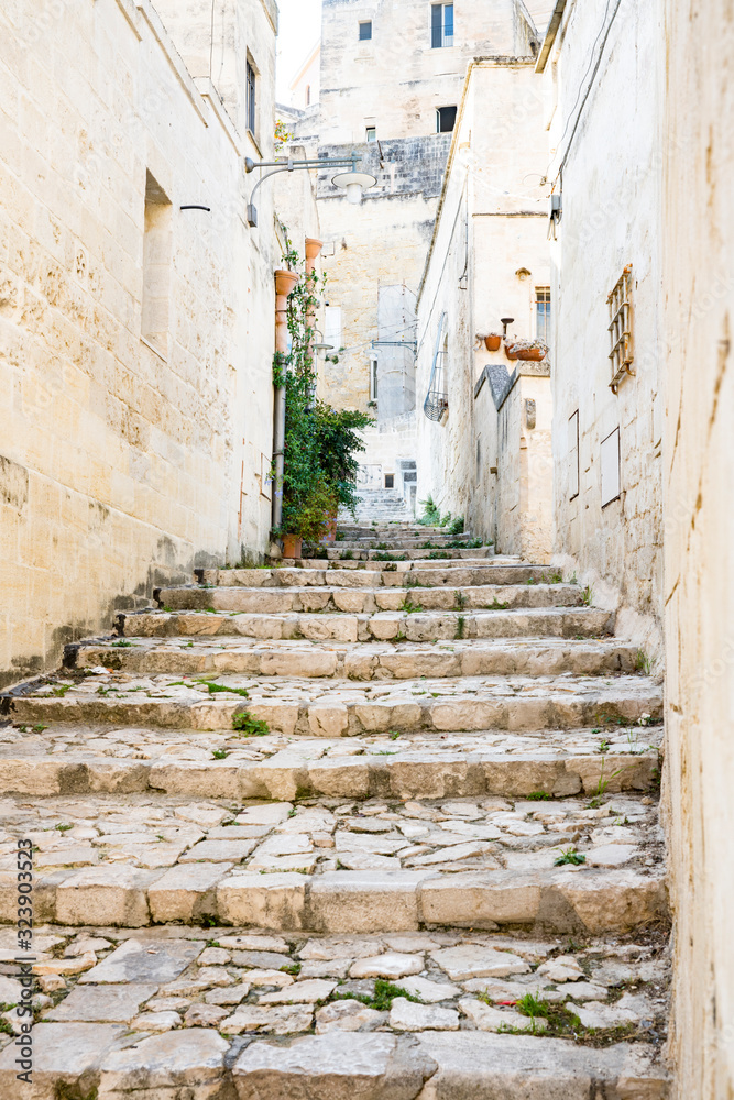 Small street with cobblestone stairs in Unesco town Matera, Italy 