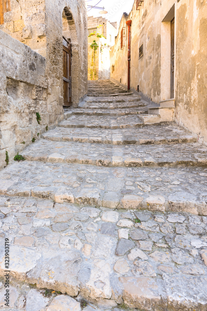 small street with stairs in Unesco village Matera. Italy