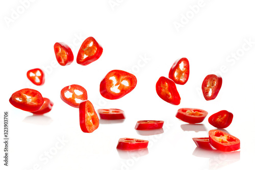 Chili pepper sliced in rings close-up, flying in the air