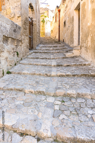 Fototapeta Naklejka Na Ścianę i Meble -  small street with stairs in Unesco village Matera. Italy