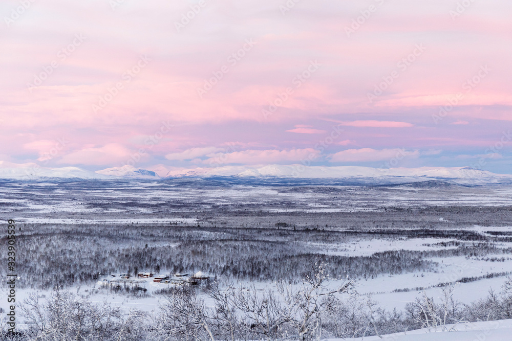 winter mountain landscape with pink sky