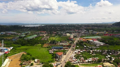 Car traffic, top view. Cityscape in the asian town. Road and streets in the town of Tacloban, Philippines.