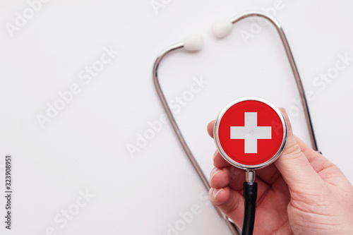 Switzerland healthcare concept. Doctor holding a medical stethoscope. photo