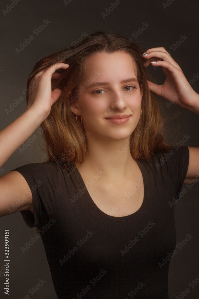 Studio portrait of a girl in a black t-shirt Studio portrait of a girl in a black t-shirt