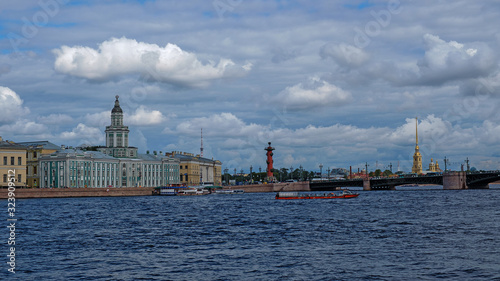 View from the river to the embankment and the bridge, ships on the water. Neva River, St. Pererburg, summer.