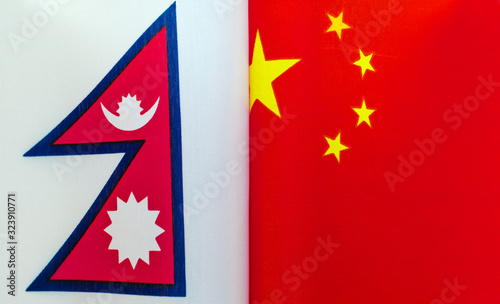 fragments of national flags of Nepal and China close-up