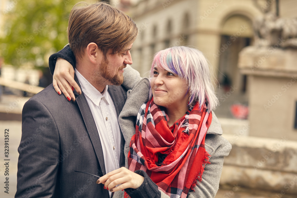 couple in love outdoor.Stunning sensual outdoor portrait of young stylish fashion couple posing in spring in city couple in love outdoor.Stunning sensual outdoor portrait of young stylish fashion couple posing in spring in city