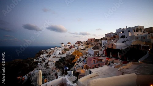 Greek village of Oia, Santorini island, Greece at down. photo