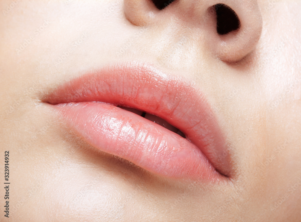 Fototapeta premium Closeup macro portrait of female red smiling lips with day beauty makeup.