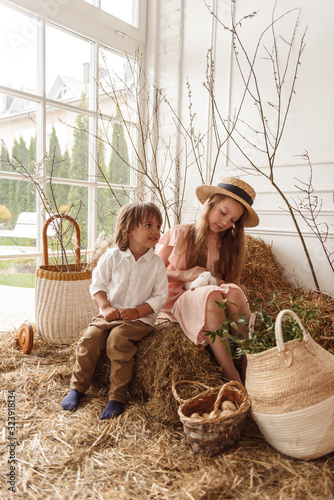 Children at Easter with rabbits and ducks