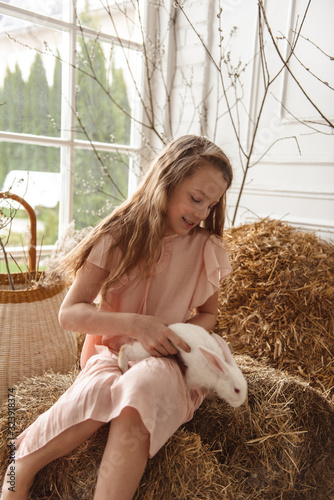 Children at Easter with rabbits and ducks