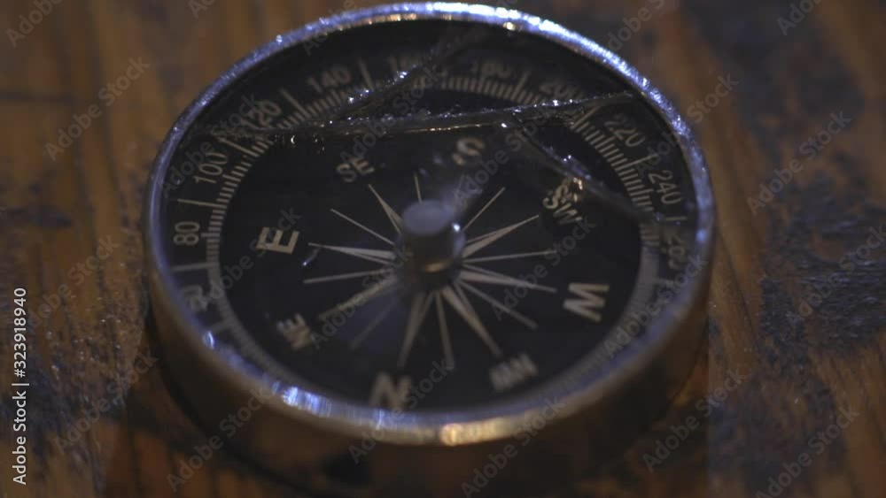A malfunctioning compass with broken glass cover- Close-up shot A malfunctioning compass with broken glass cover- Close-up shot
