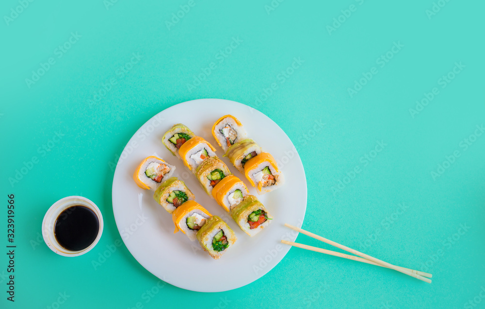 vegetarian sushi rolls on a white plate on a green vegetarian sushi rolls on a white plate on a green