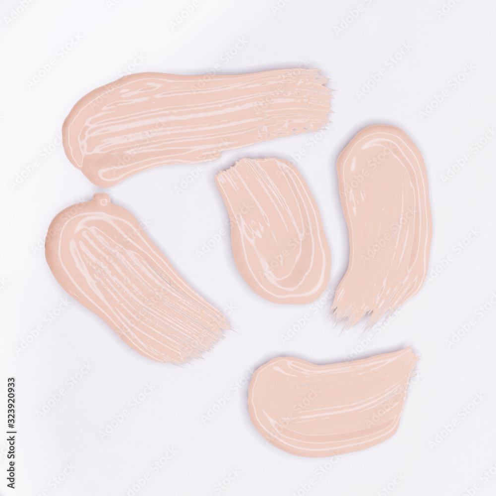 Makeup foundation smudges isolated on white background Makeup foundation smudges isolated on white background