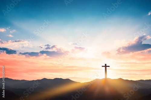 Stampa su Tela Silhouette cross on mountain sunset background