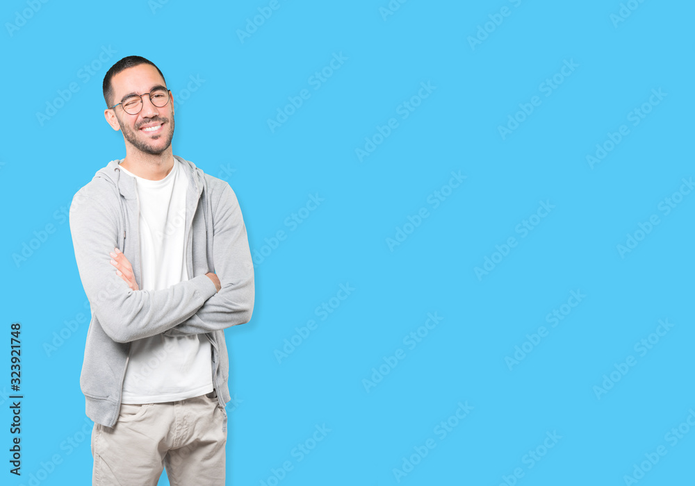 Friendly young man winking an eye Friendly young man winking an eye
