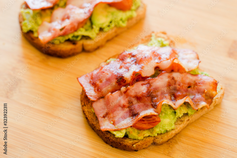 avocado toast with cherries tomatoes and bacon