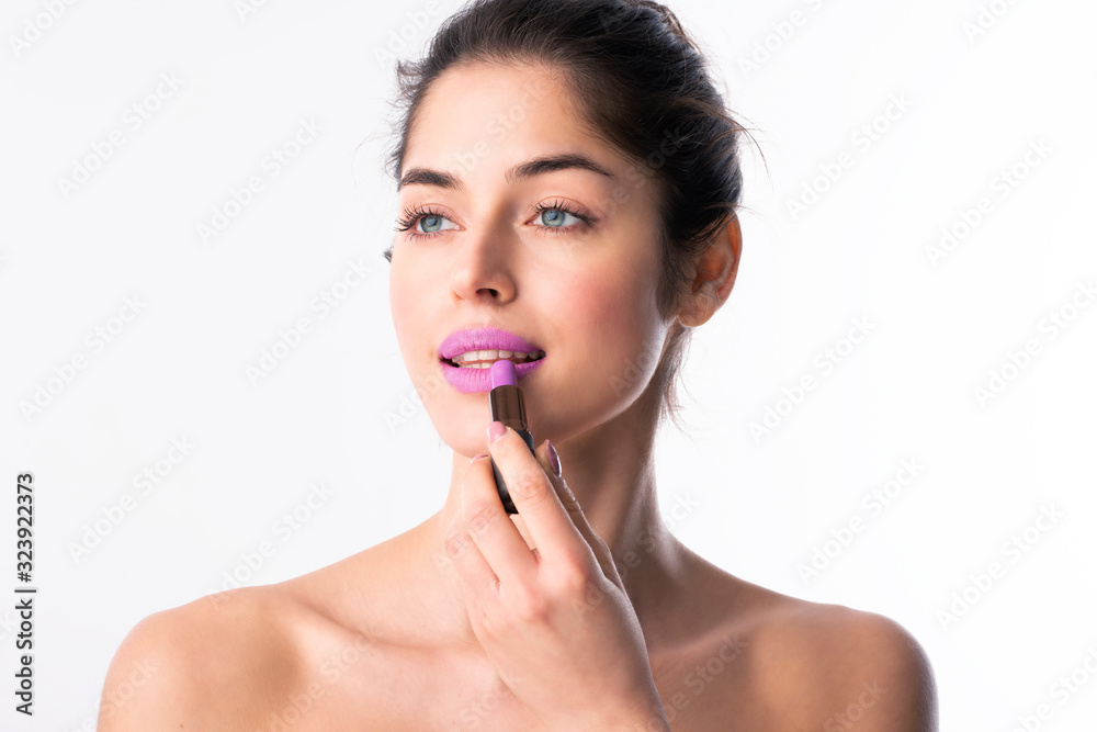 Beauty shot of beautiful woman applying lipstick Beauty shot of beautiful woman applying lipstick