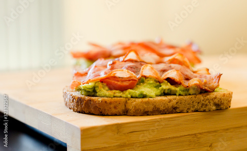 avocado toast with cherries tomatoes and bacon