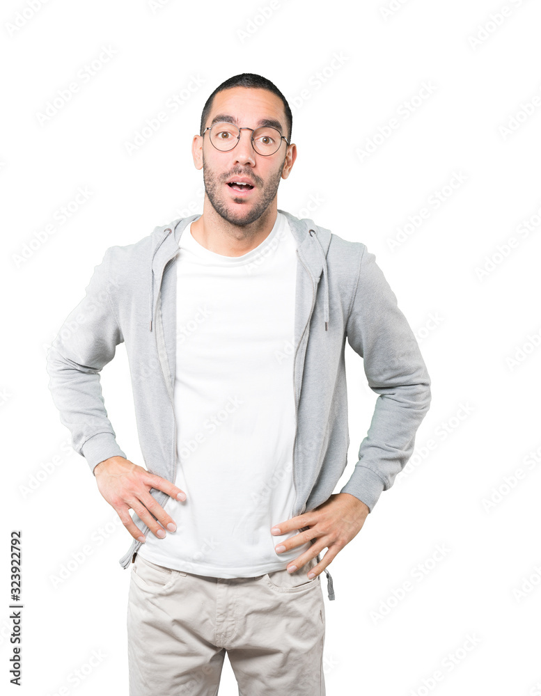 Fototapeta premium Amazed young man looking up gesture