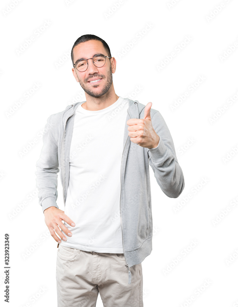 Happy young man gesturing that everything is fine Happy young man gesturing that everything is fine
