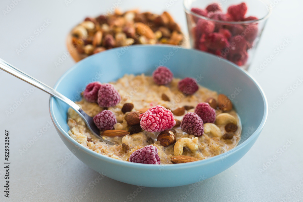 oatmeal with nuts and raspberries oatmeal with nuts and raspberries