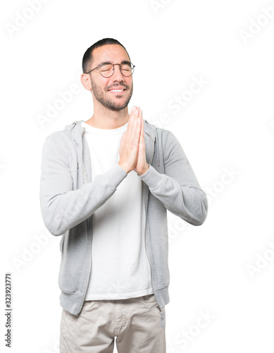 Concerned young man praying gesture © agongallud