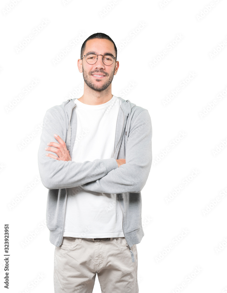 Satisfied young man with crossed arms gesture Satisfied young man with crossed arms gesture