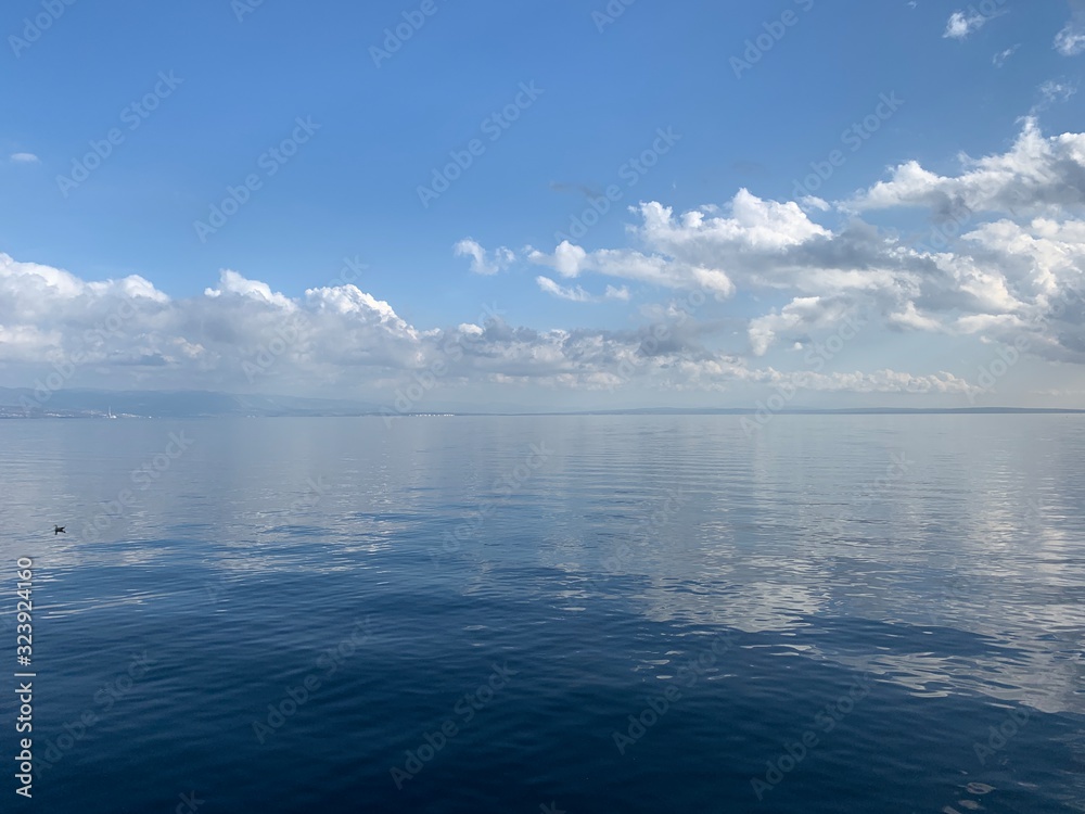 Sky reflection on the surface of the sea, natural colors
